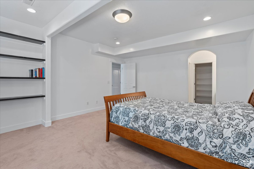 Bedroom with light carpet