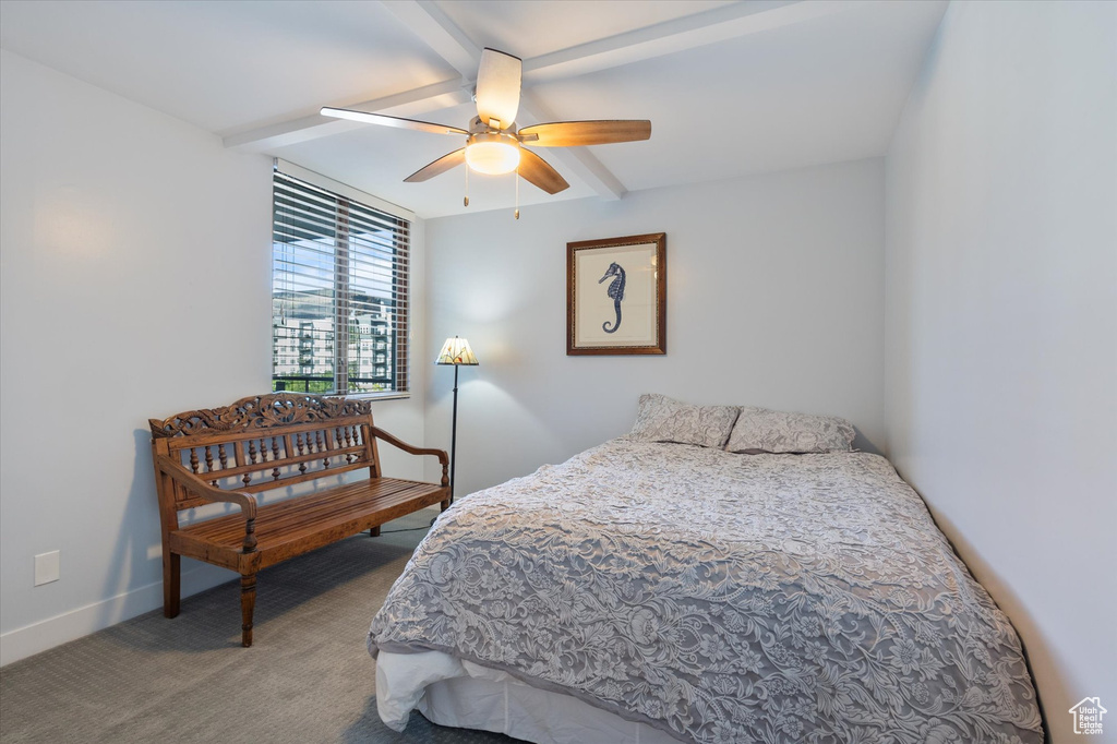 Carpeted bedroom with ceiling fan