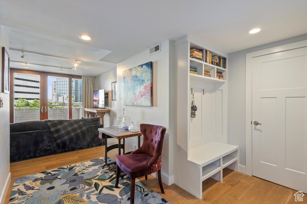 Mudroom with light hardwood / wood-style floors