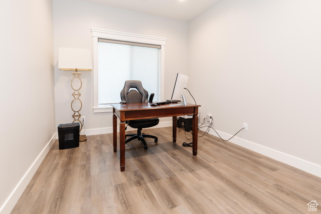 Office space featuring light hardwood / wood-style flooring