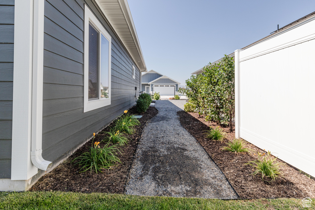 View of yard with an outbuilding and a garage