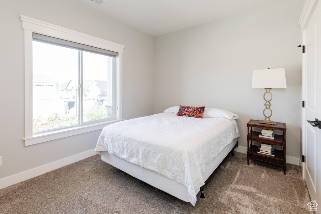 Bedroom with carpet flooring