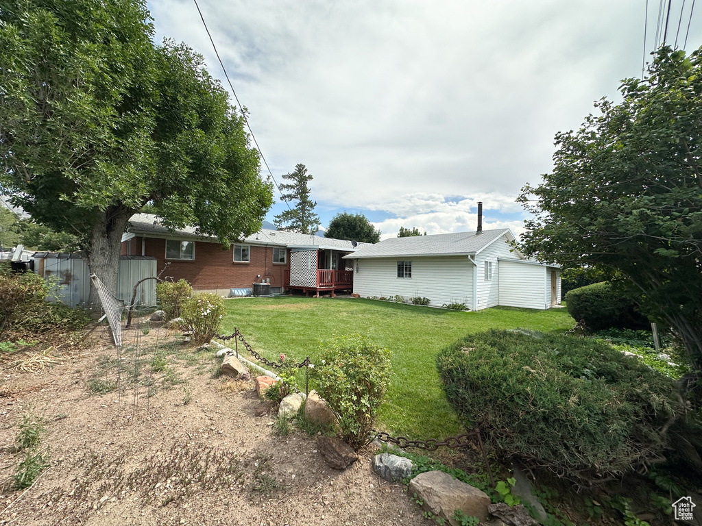 View of yard with an outbuilding and a garage