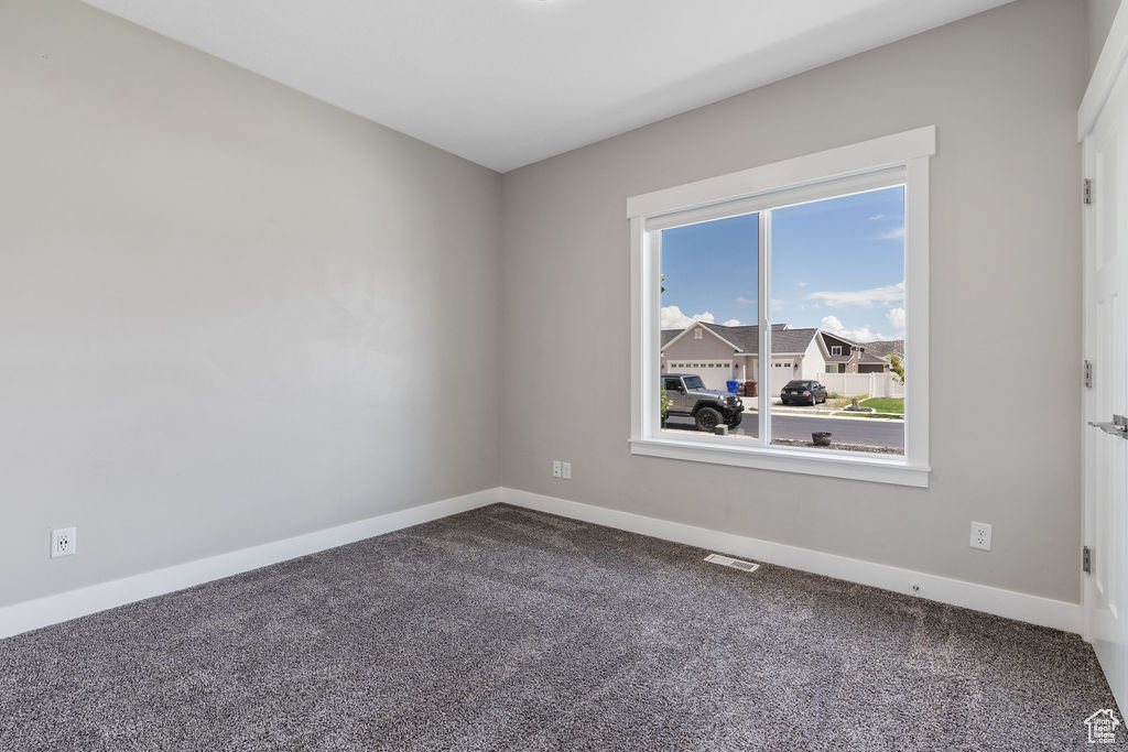 Empty room with carpet flooring