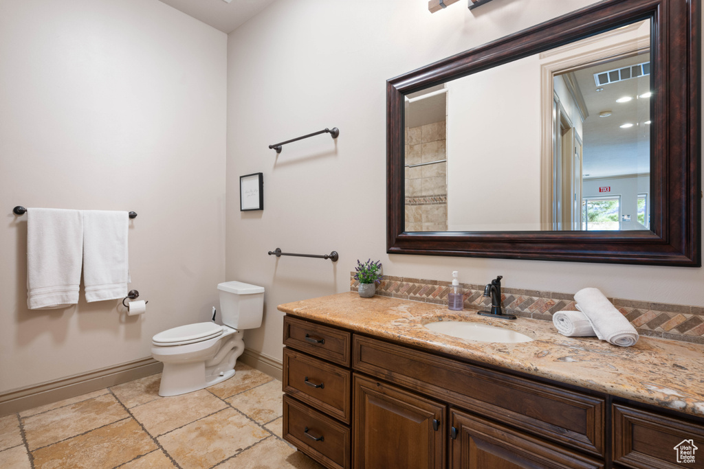 Bathroom featuring toilet and vanity