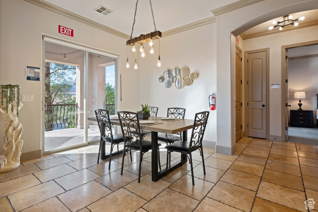 Dining room featuring crown molding