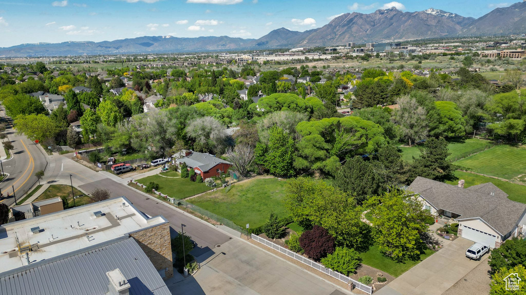Aerial view of residential area featuring a mountainous background