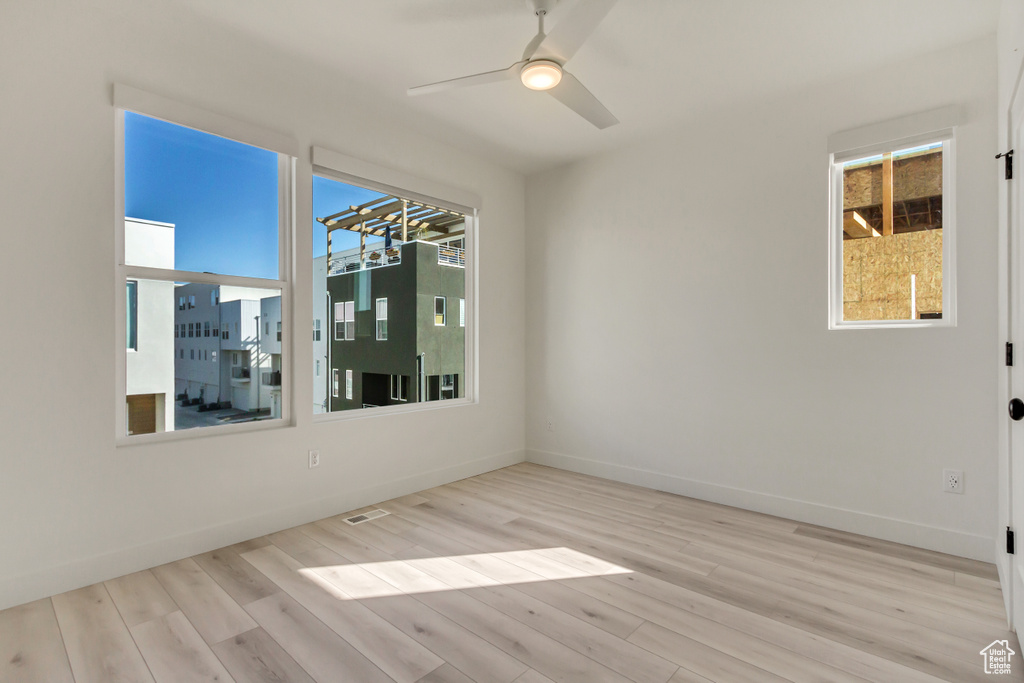 Spare room featuring light hardwood / wood-style flooring and ceiling fan