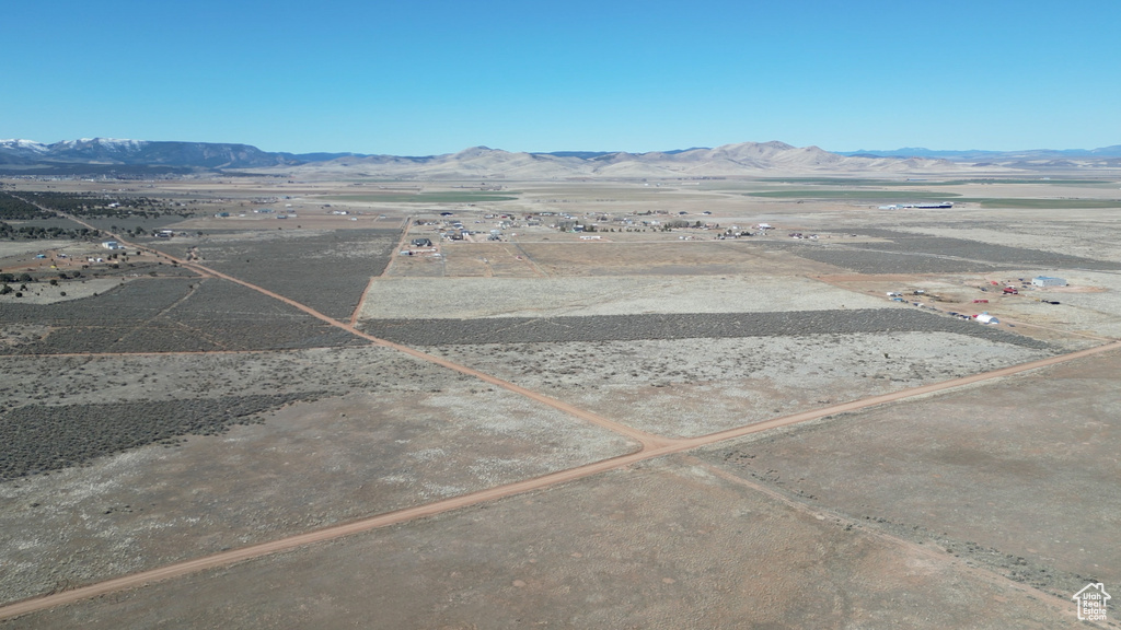 Birds eye view of property with a mountain view