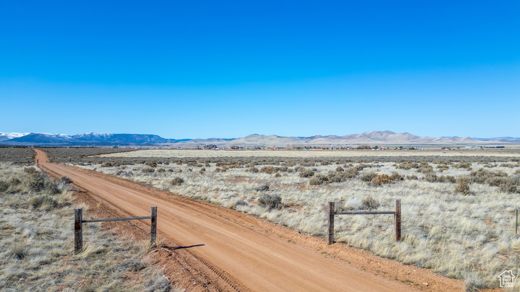 Property view of mountains with a rural view