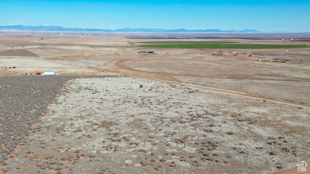 Birds eye view of property with a mountain view and a rural view