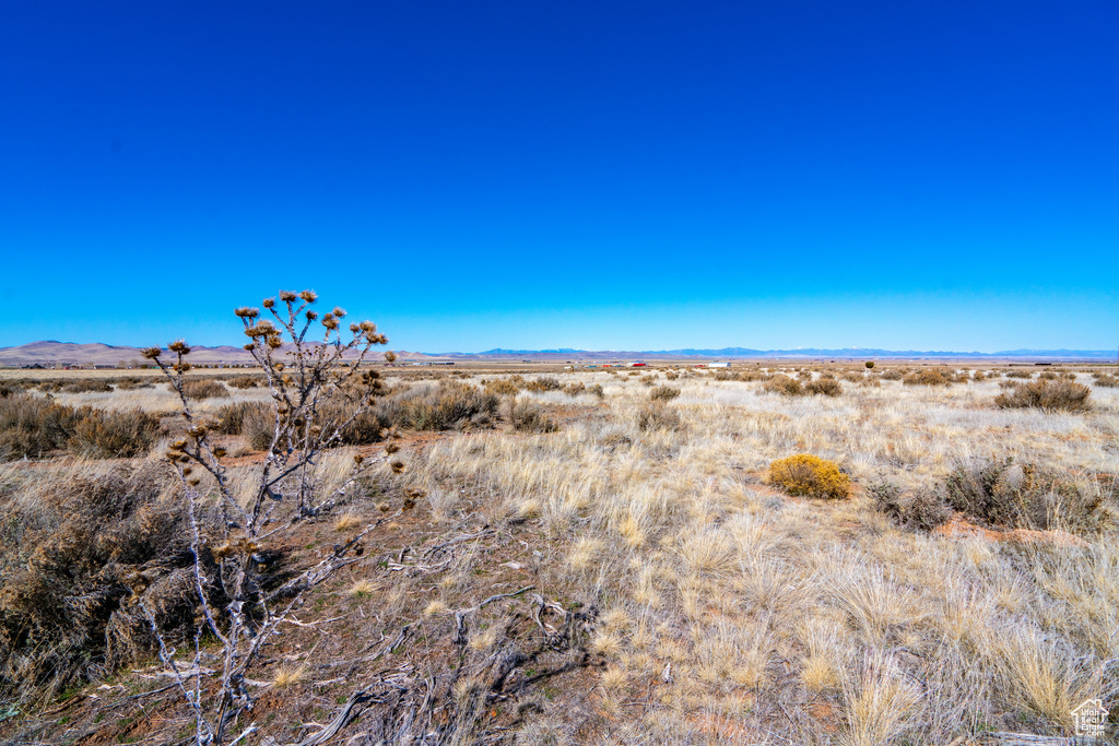 Property view of mountains featuring a rural view