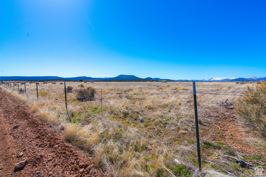 Property view of mountains with a rural view