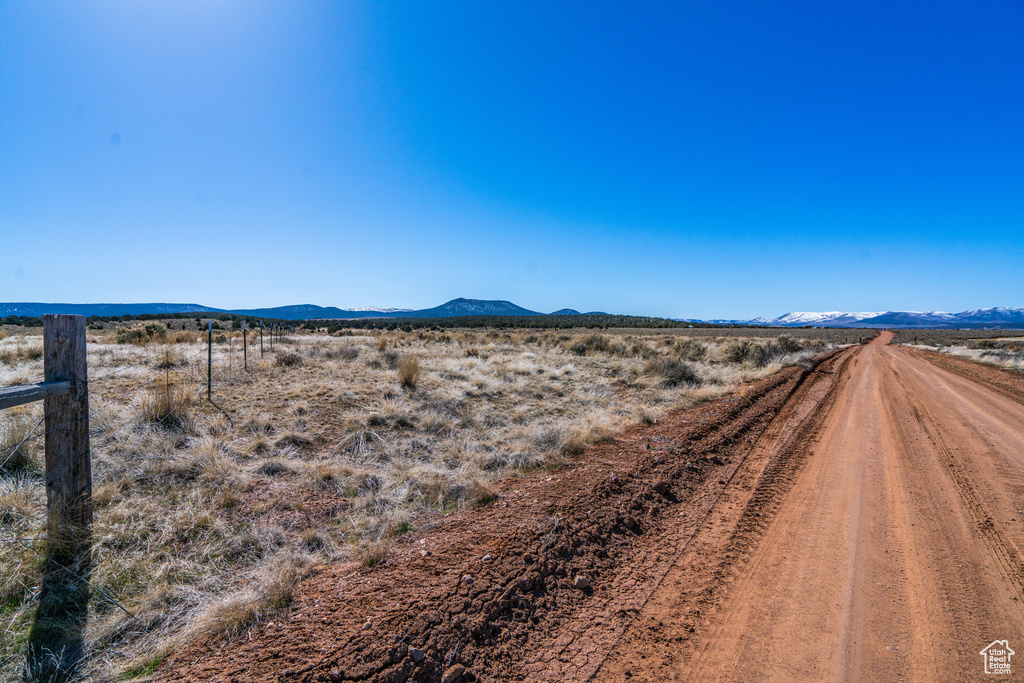 Property view of mountains with a rural view