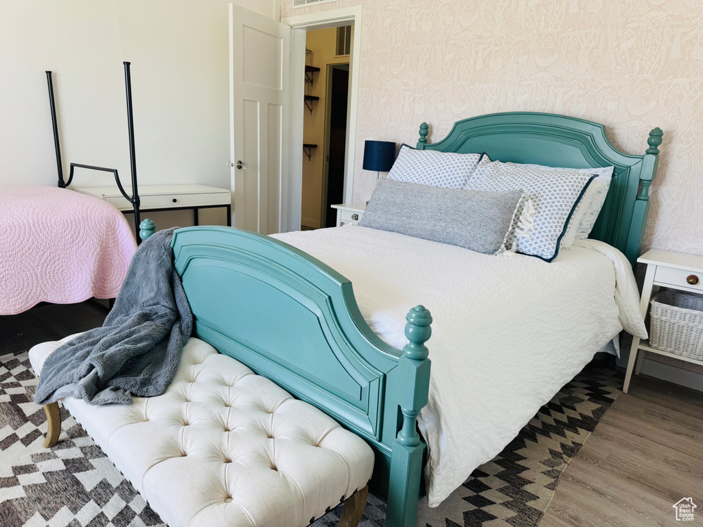 Bedroom with wood finished floors