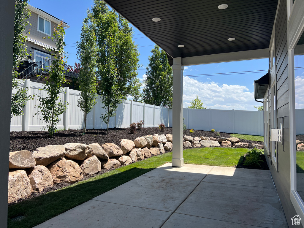 Fenced backyard featuring a patio area