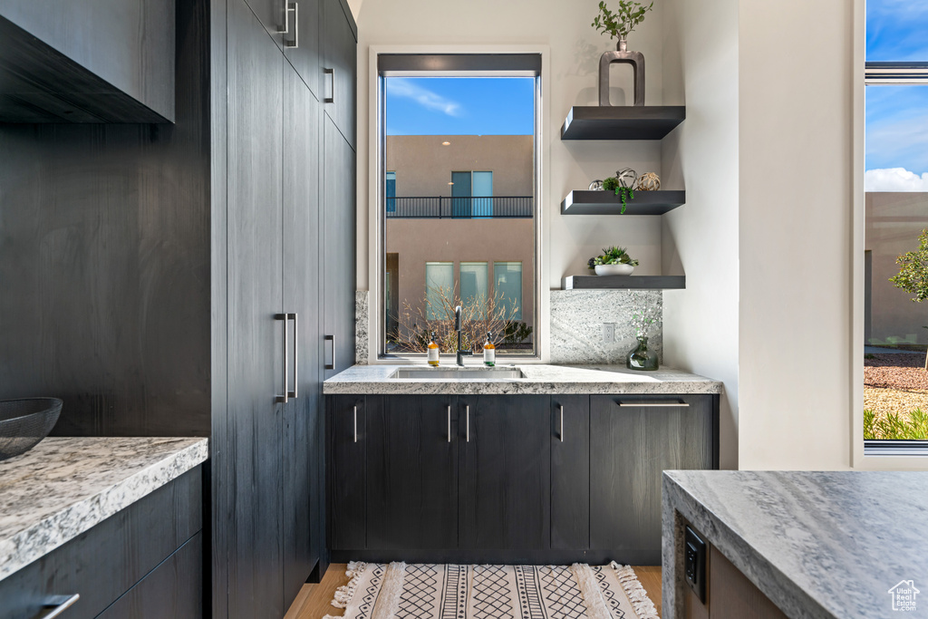 Interior space with vanity and hardwood / wood-style flooring