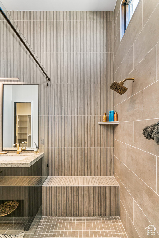 Bathroom with a tile shower and vanity