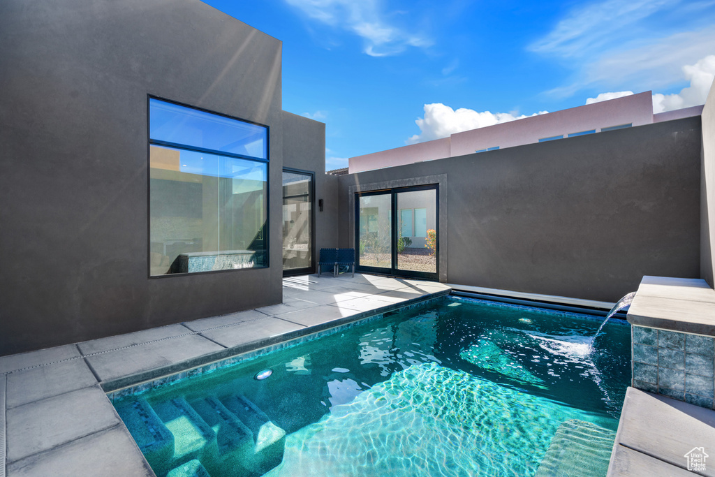 View of pool with pool water feature