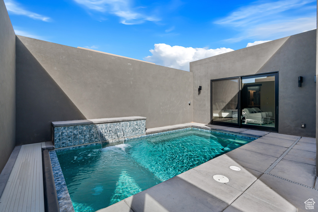 View of pool featuring pool water feature