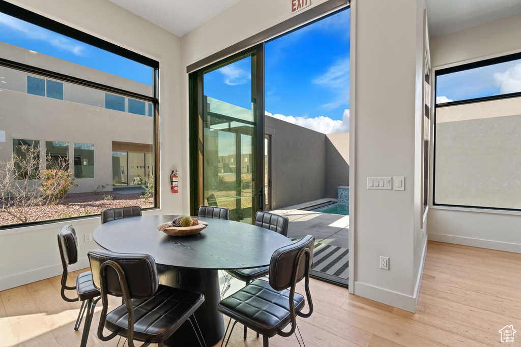 Dining room featuring plenty of natural light and light hardwood / wood-style flooring