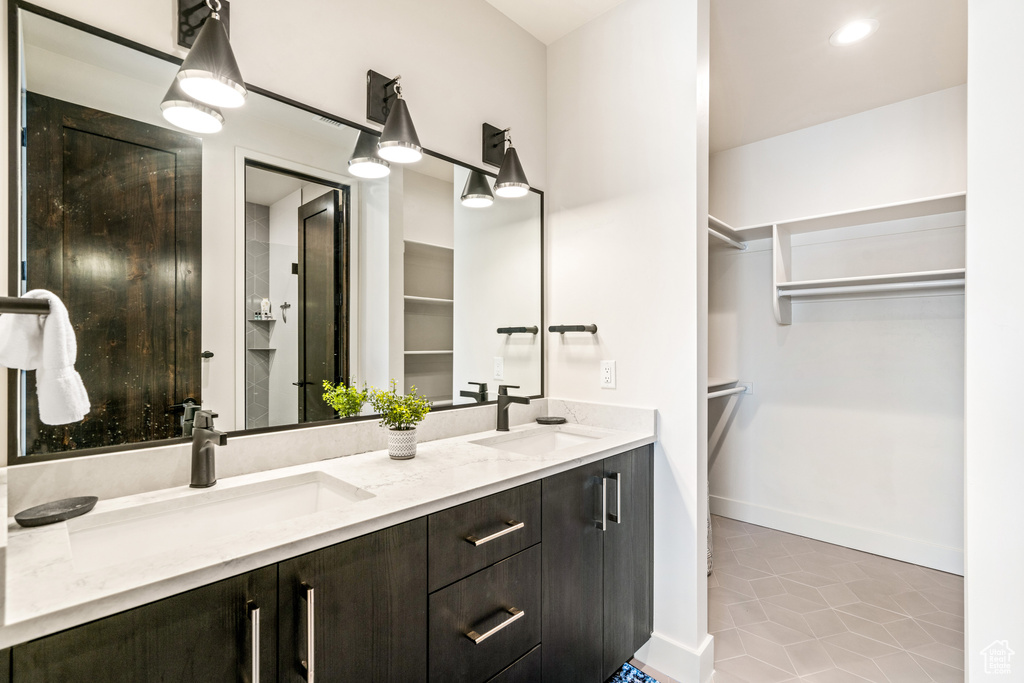 Bathroom with vanity and tile patterned floors