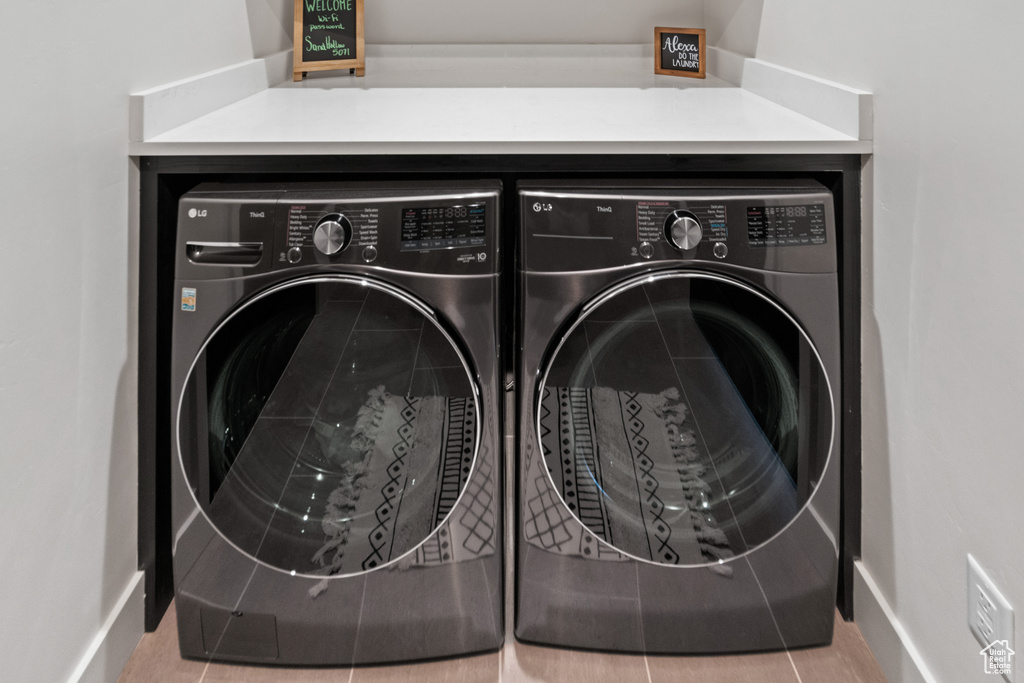 Laundry room featuring washing machine and clothes dryer