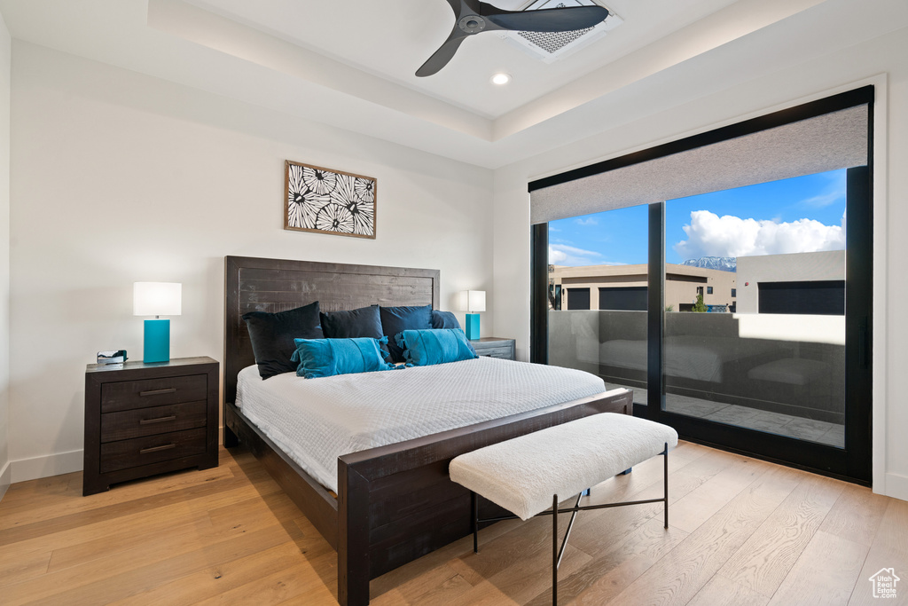 Bedroom featuring ceiling fan and light hardwood / wood-style floors