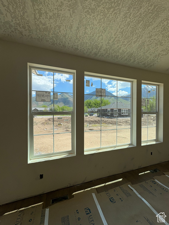Spare room with healthy amount of natural light