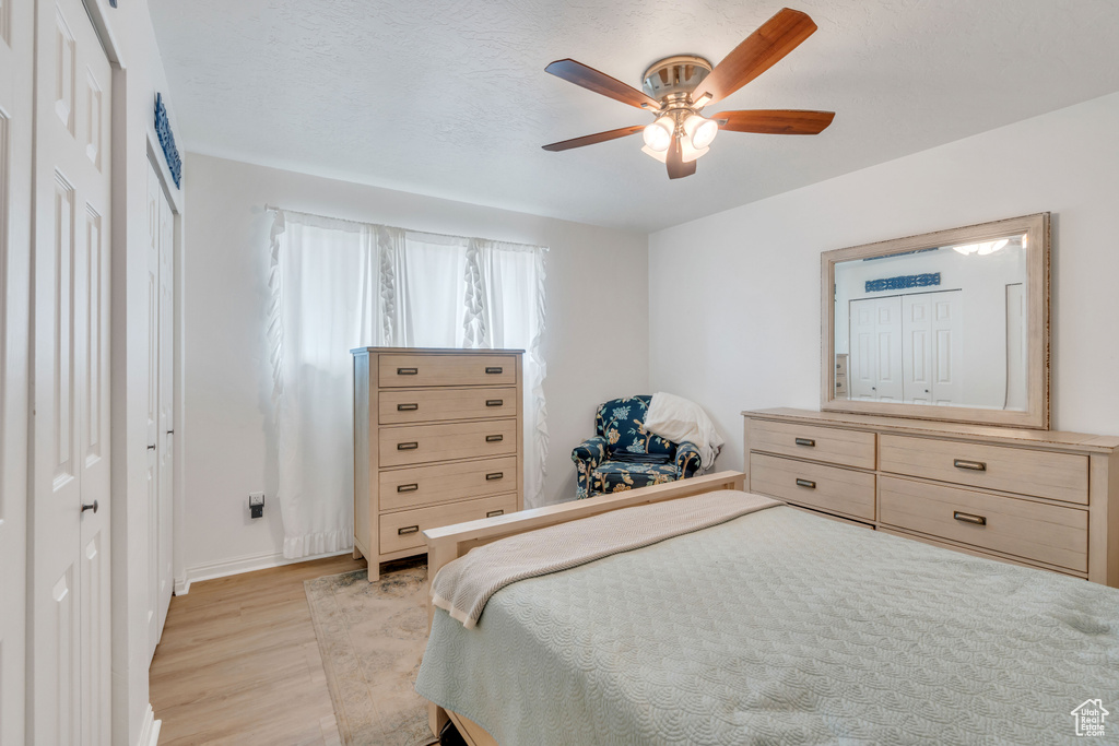 Bedroom featuring ceiling fan and light hardwood / wood-style floors