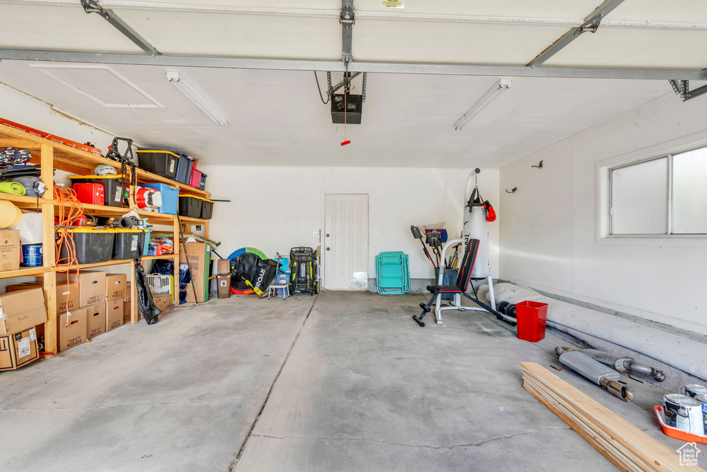 Garage featuring a garage door opener