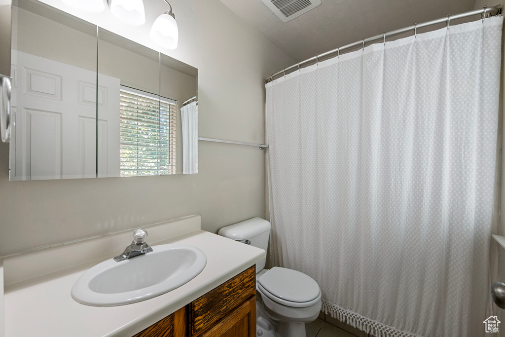 Bathroom with vanity and toilet