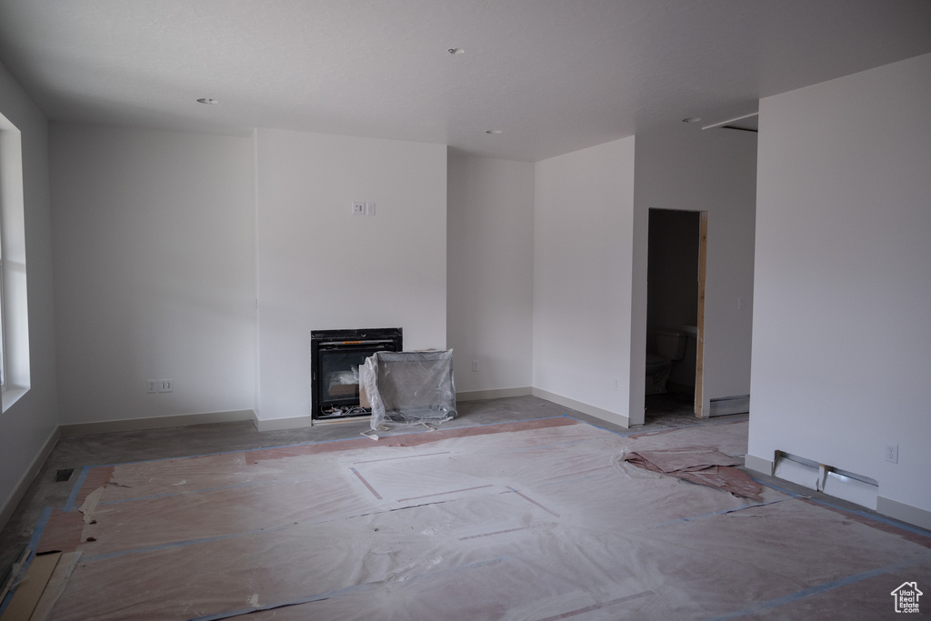 Unfurnished living room with a fireplace