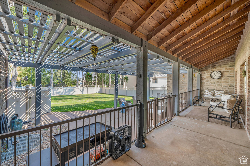View of patio with a fenced backyard and a pergola