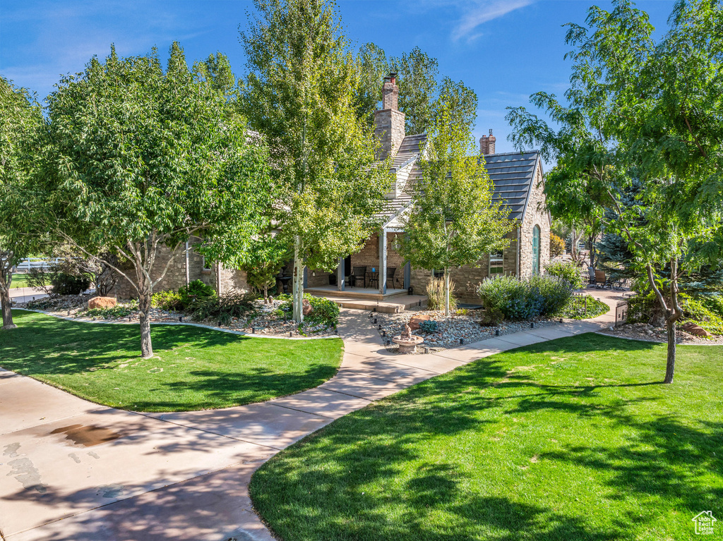 View of property's community featuring a lawn