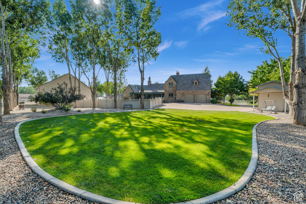 View of yard with a garage