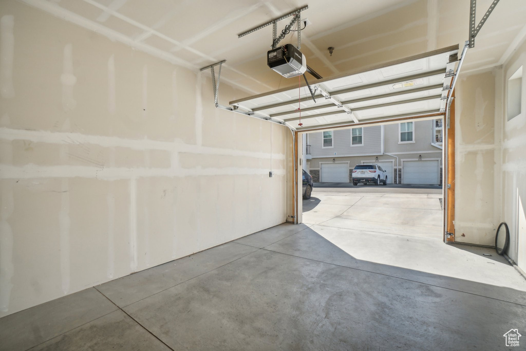 Garage featuring a garage door opener