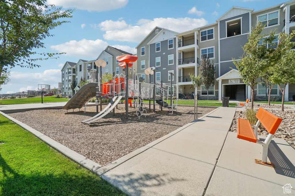 View of playground with a lawn