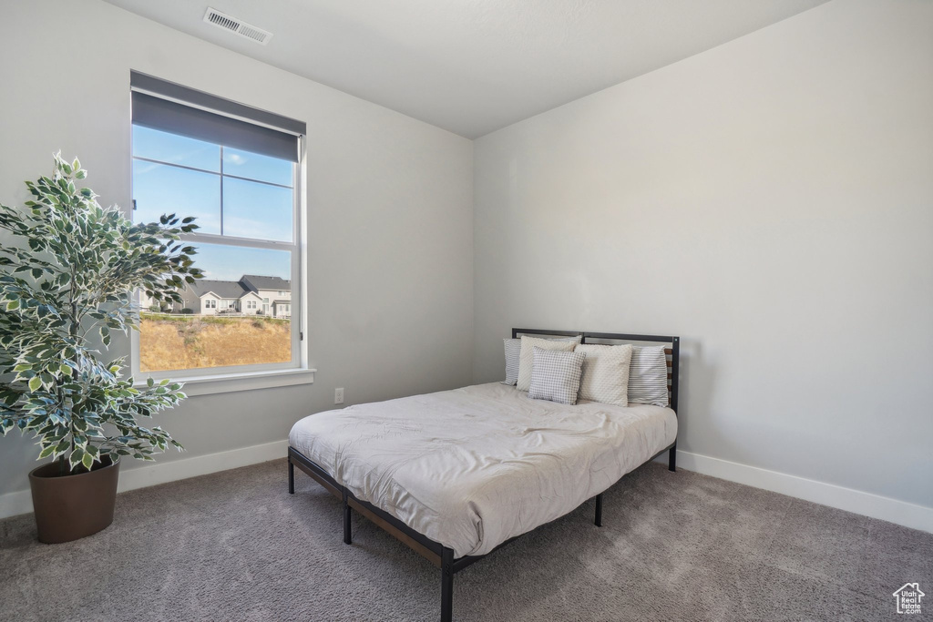 Bedroom featuring carpet flooring