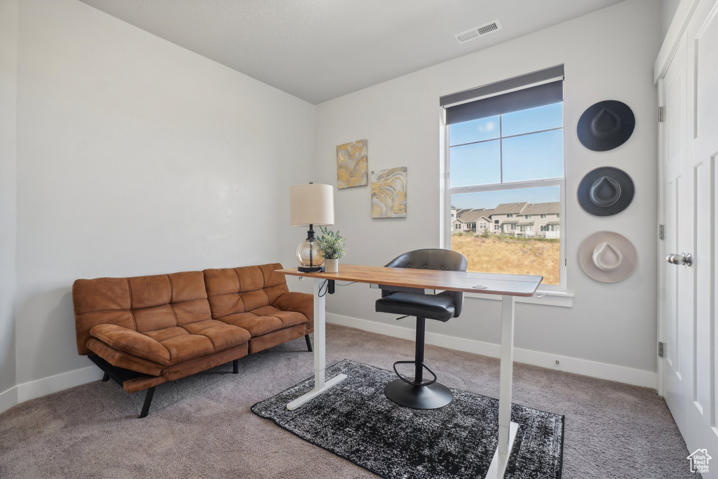 Living area featuring carpet flooring