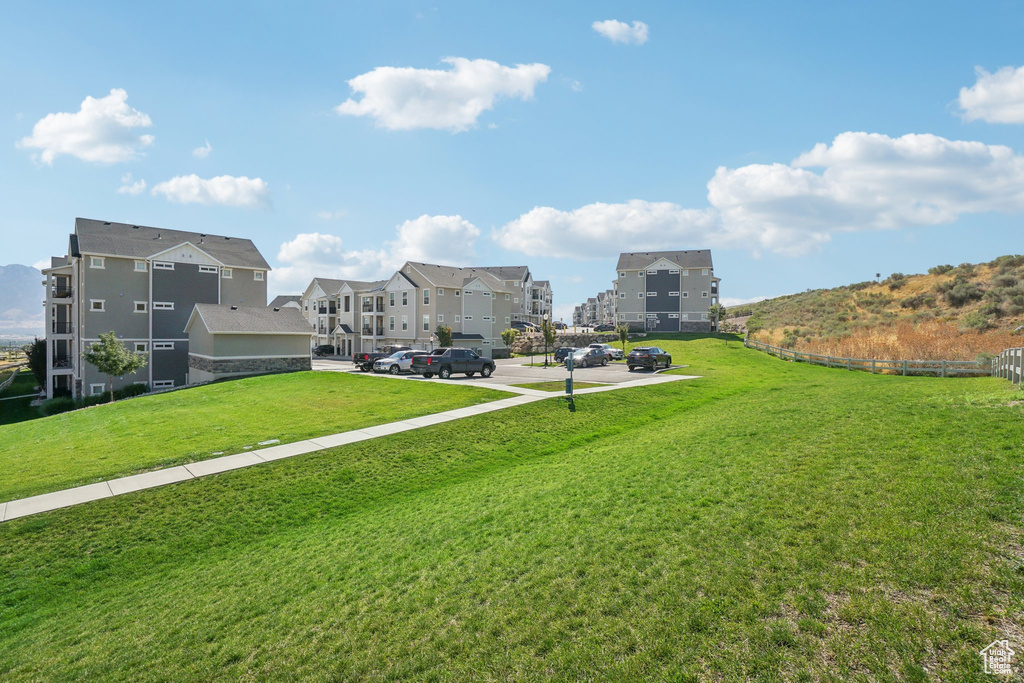 View of home's community featuring a lawn