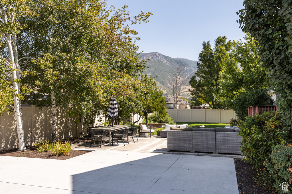 View of patio featuring a mountain view and an outdoor hangout area