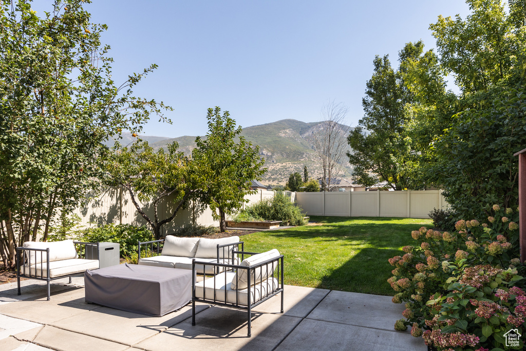 View of patio / terrace with a mountain view