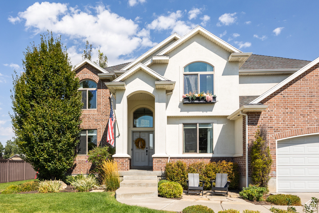 View of front of property with a garage