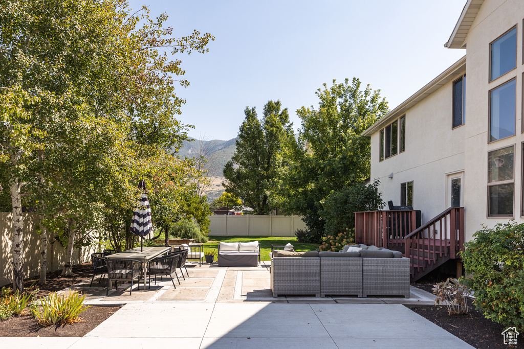 View of patio / terrace with a mountain view and an outdoor hangout area