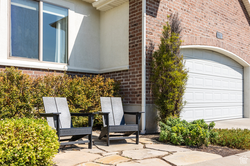 View of patio / terrace featuring a garage