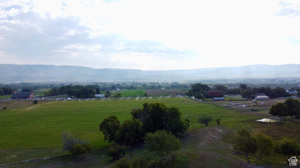 Property view of mountains with a rural view