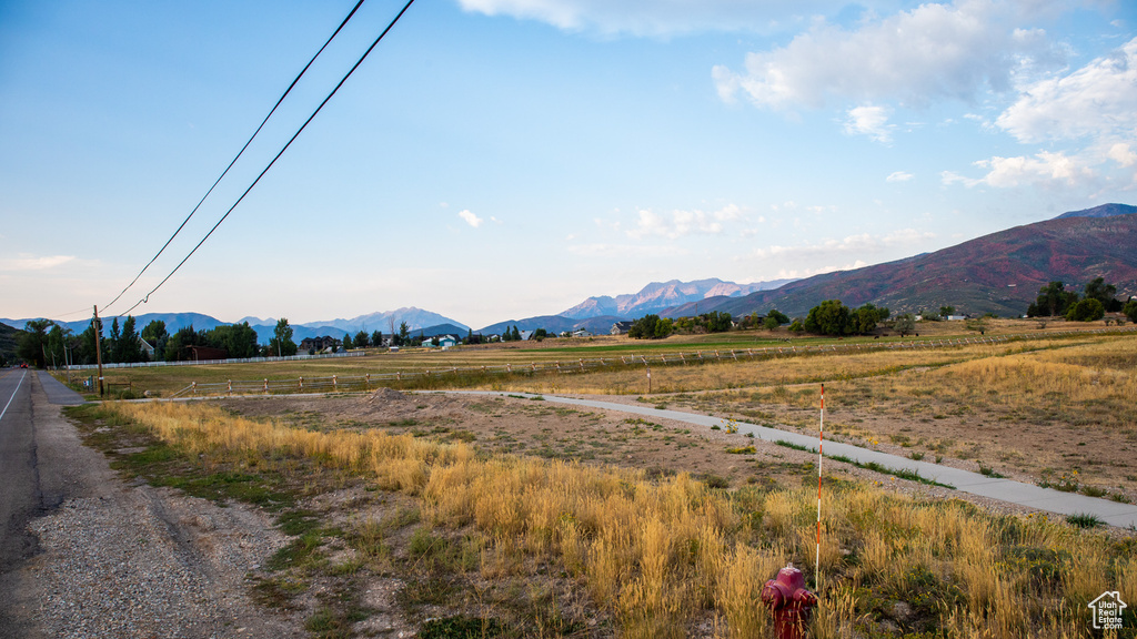 Property view of mountains featuring a rural view