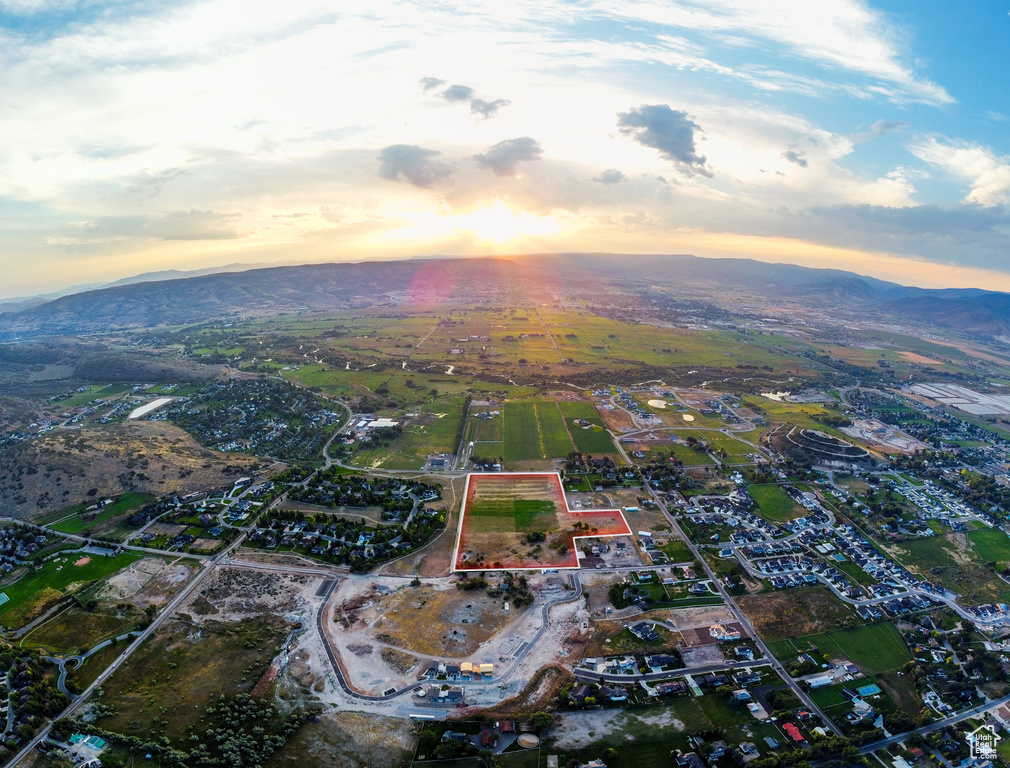 Aerial view at dusk featuring a mountain view