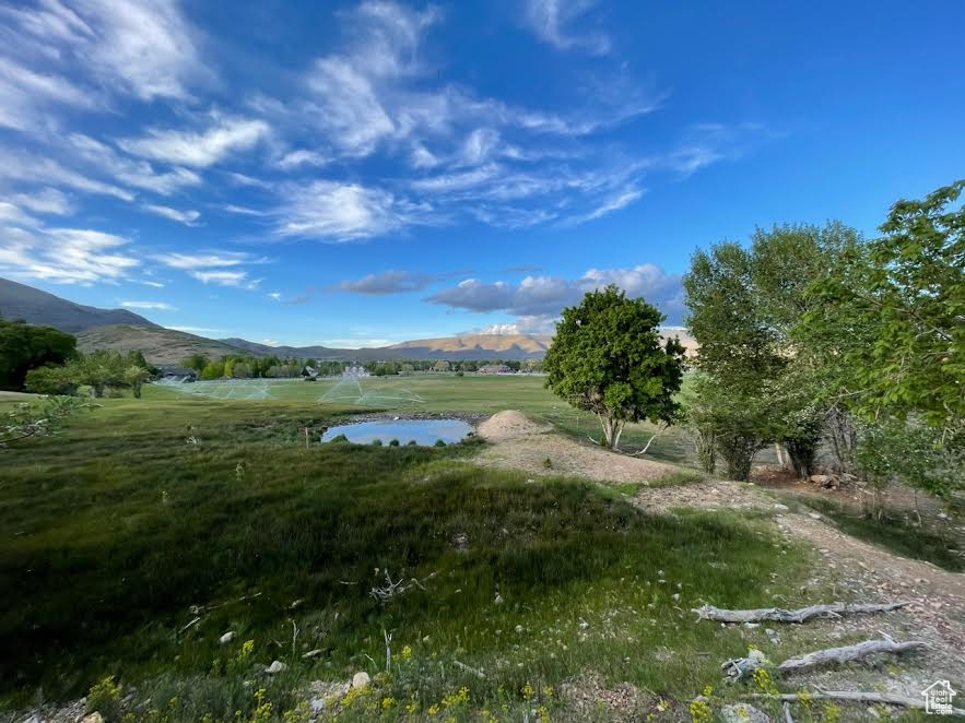 Exterior space with a rural view and a water and mountain view